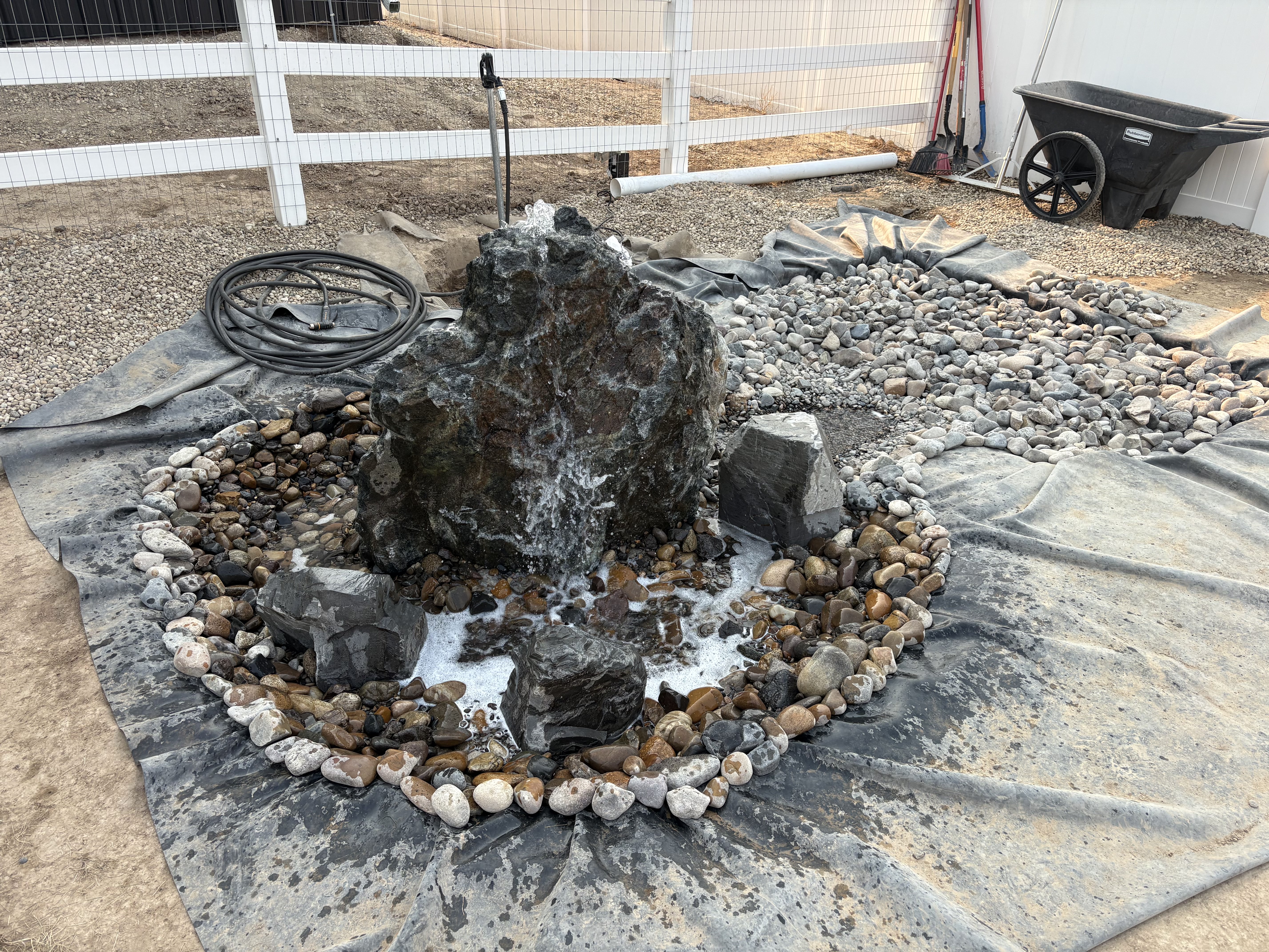 Project 04 boulder water feature and rock creek bed under construction